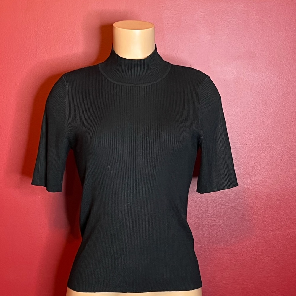 Free second-hand black turtleneck with the purchase of one of our bundles.